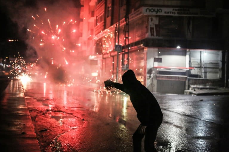 Kurdish millitants threw fireworks at Turkish riot police during a demonstration in Istanbul on November 28, 2015 after a top Kurdish lawyer was killed in Diyarbakir