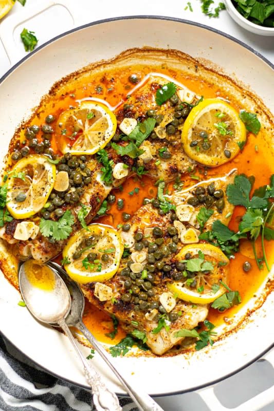 <p>Midwest Foodie</p><p>This healthy Mediterranean baked fish dinner takes just 20 minutes from start to finish and is made with only 8 ingredients!</p><p><strong>Get the recipe: <a href="https://midwestfoodieblog.com/mediterranean-fish/" rel="nofollow noopener" target="_blank" data-ylk="slk:Easy Mediterranean Baked Cod;elm:context_link;itc:0;sec:content-canvas" class="link rapid-noclick-resp"><em>Easy Mediterranean Baked Cod</em></a></strong></p>