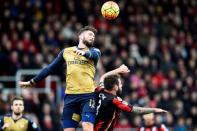 Football Soccer - AFC Bournemouth v Arsenal - Barclays Premier League - Vitality Stadium - 7/2/16 Arsenal's Olivier Giroud in action with Bournemouth's Steve Cook Reuters / Dylan Martinez Livepic