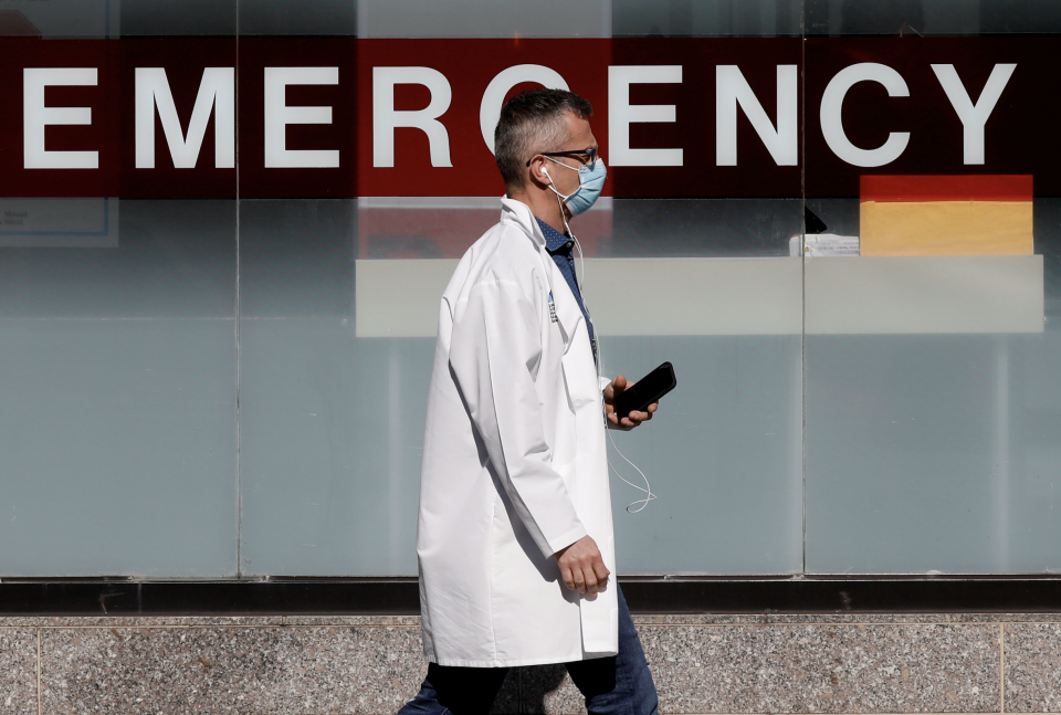 A doctor wears a protective mask as he walks outside Mount Sinai Hospital in Manhattan during the outbreak of the coronavirus disease (COVID-19) in New York City, New York, U.S., April 1, 2020. (Photo: REUTERS/Brendan Mcdermid)