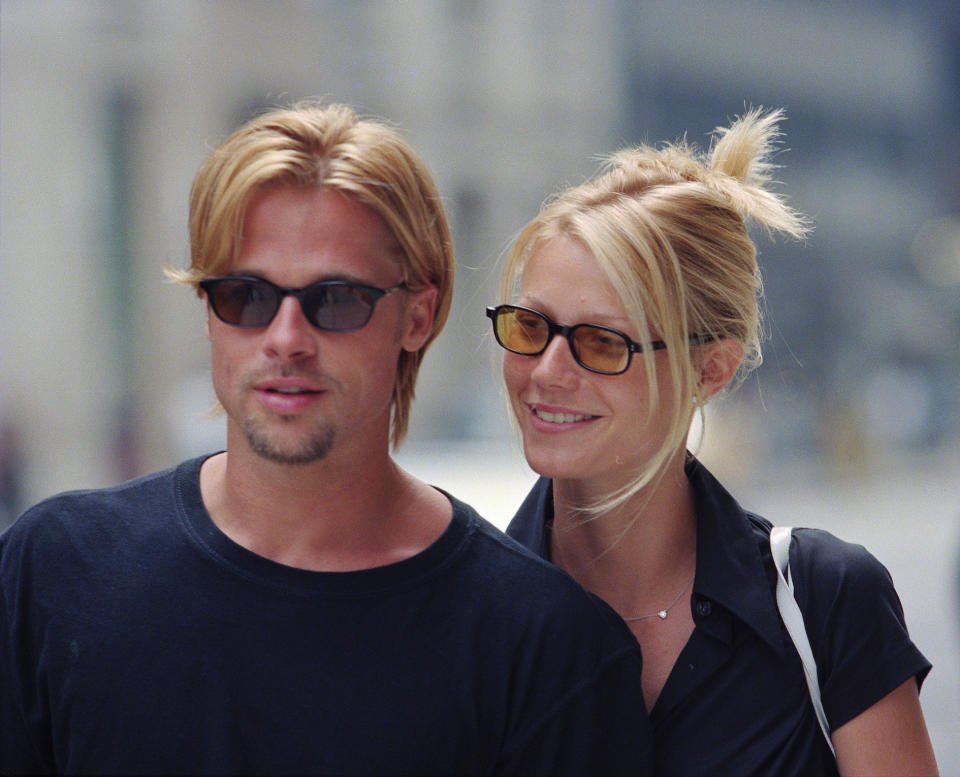 Brad and Gwyneth both dressed in black and walking down the street of NYC