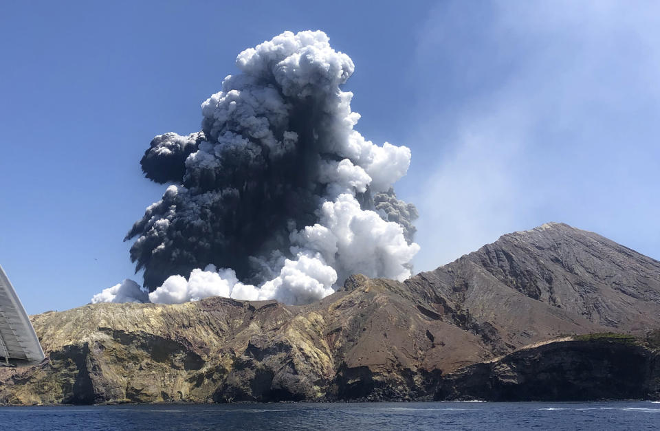 The eruption of the volcano on White Island off the coast of Whakatane, New Zealand is seen.