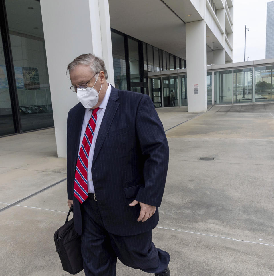 Former Georgia Insurance Commissioner Jim Beck leaves the Richard B. Russell Federal Courthouse after his sentencing on Tuesday, Oct 12, 2021, in Atlanta, Ga. A federal judge has sentenced Beck to more than seven years in prison for fraud. The judge on Tuesday also ordered Beck to pay $2.6 million in restitution to make up for money he stole from an insurer. (Jenni Girtman/Atlanta Journal-Constitution via AP)