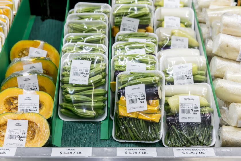 ONTARIO, CALIFORNIA - Feb. 17, 2020: Pre-cut vegetables for Filipino specialties at the Greenhills Market & Fast Food, a mom-and-pop, Filipino-inspired food counter and grocery store in a strip mall in Ontario, on Monday, Feb. 17, 2020. (Silvia Razgova / For the Times) Food shots: 1. Garlic fried-rice with pork tocino and fried eggs, served with a side of vinegar, chillies and coffee 2. Beef kare kare in peanut and shrimp-paste sauce with green beans and bokchoy, served with a side of shrimp paste 3. Beef Royal - beef in a tomato sauce with potatoes, eggs and carrots 4. in group: 1,2,3 and noodle palabok (noodles with shrimp and ground pork and fried garlic) Sides of tupig (sticky rice with coconut milk), Sweet human natal (sticky rice with sugar), fried breaded dilis (smelt), fried calamaris, pork Shanghai (mini egg rolls), and fried chicken skins. Assignment ID: 494077