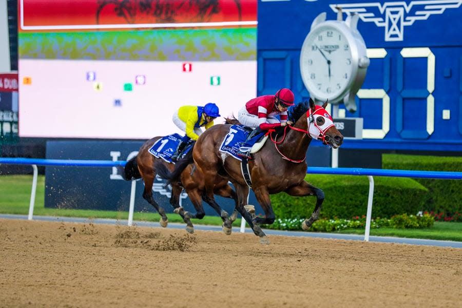 Forever Young and jockey Ryusei Sakai race past Auto Bahn to win Saturday's UAE Derby at Meydan Racecourse in Dubai, United Arab Emirates.