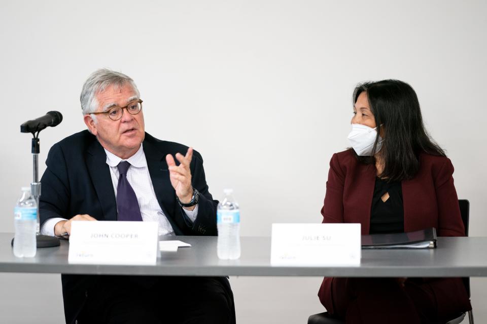 Mayor John Cooper, left, speaks with U.S. Deputy Secretary of Labor Julie Su, right, during a forum focused on equity in workforce development at Project Return in Nashville, Tenn., Tuesday, Sept. 6, 2022.