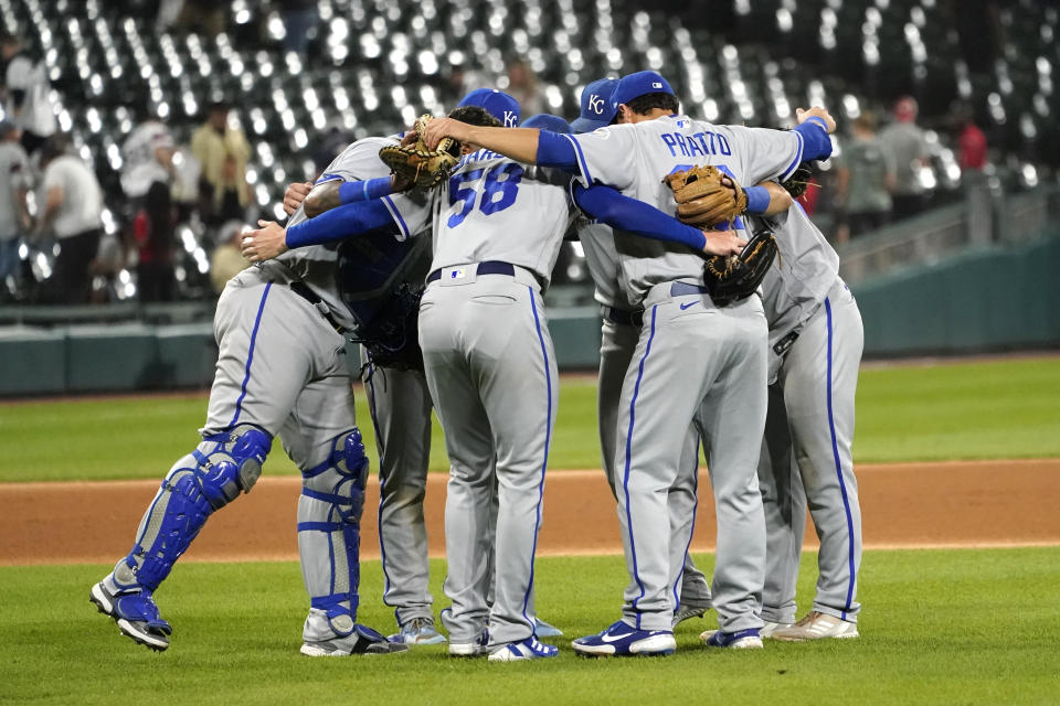 Kansas City Royals celebrate the team's 9-7 win over the Chicago White Sox in a baseball game Tuesday, Aug. 30, 2022, in Chicago. (AP Photo/Charles Rex Arbogast)