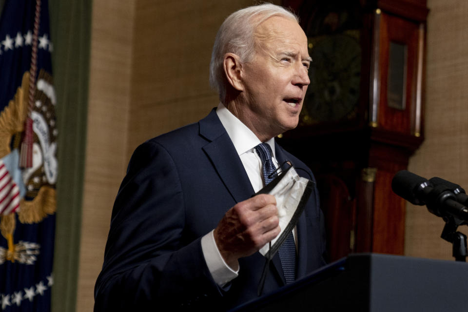 President Joe Biden removes his mask to speak from the Treaty Room in the White House on Wednesday, April 14, 2021, about the withdrawal of the remainder of U.S. troops from Afghanistan. (AP Photo/Andrew Harnik, Pool)