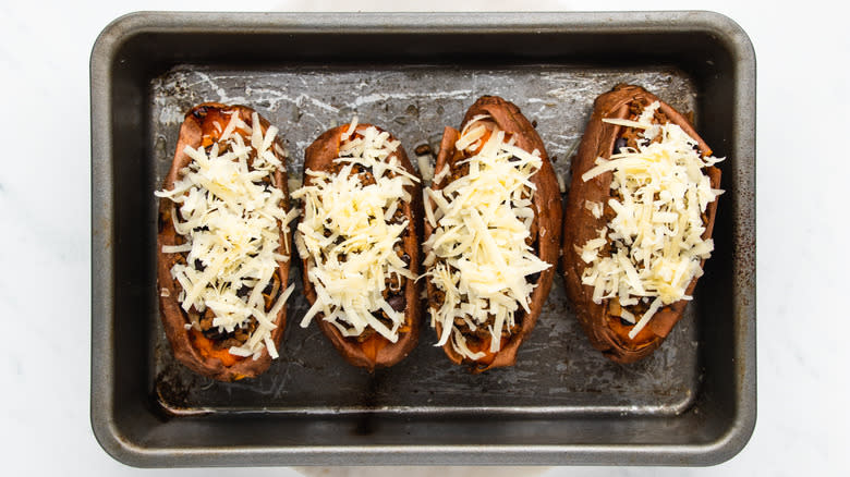 stuffed sweet potatoes topped with cheese