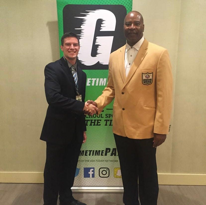 GameTimePA sports reporter Matt Allibone shakes hands with York High grad and Pro Football Hall of Famer Chris Doleman at the 2017 GameTimePA Awards Banquet. Doleman died from cancer in January 2020.