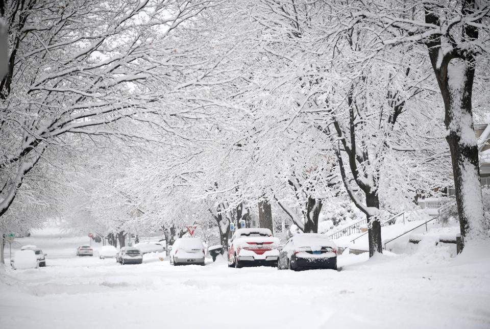 A heavy snowfall covers the city on Friday, December 9, 2022, in Sioux Falls.