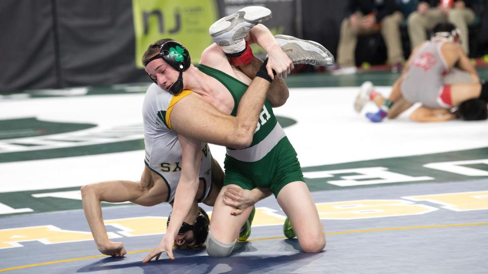 Camden Catholic's Sammy Spaulding controls Red Bank Catholic's Noah Michaels during a 120 lb. bout of the preliminary round of the NJSIAA individual wrestling championships tournament at Jim Whelan Boardwalk Hall in Atlantic City on Thursday, March 2, 2023.   Spaulding defeated Michaels by pin. 