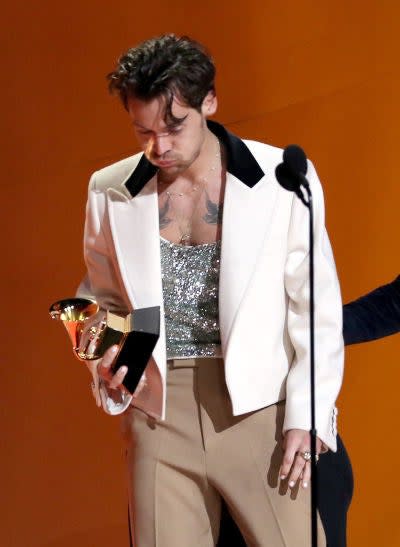 Harry looking really surprised as he takes the award for Album of the Year