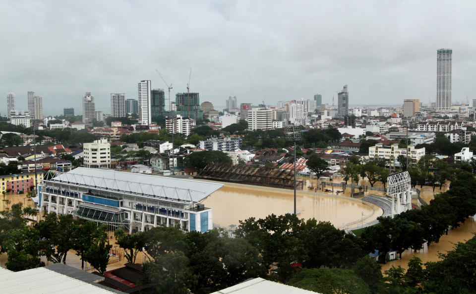 An aerial view shows a flooded stadium in George Town