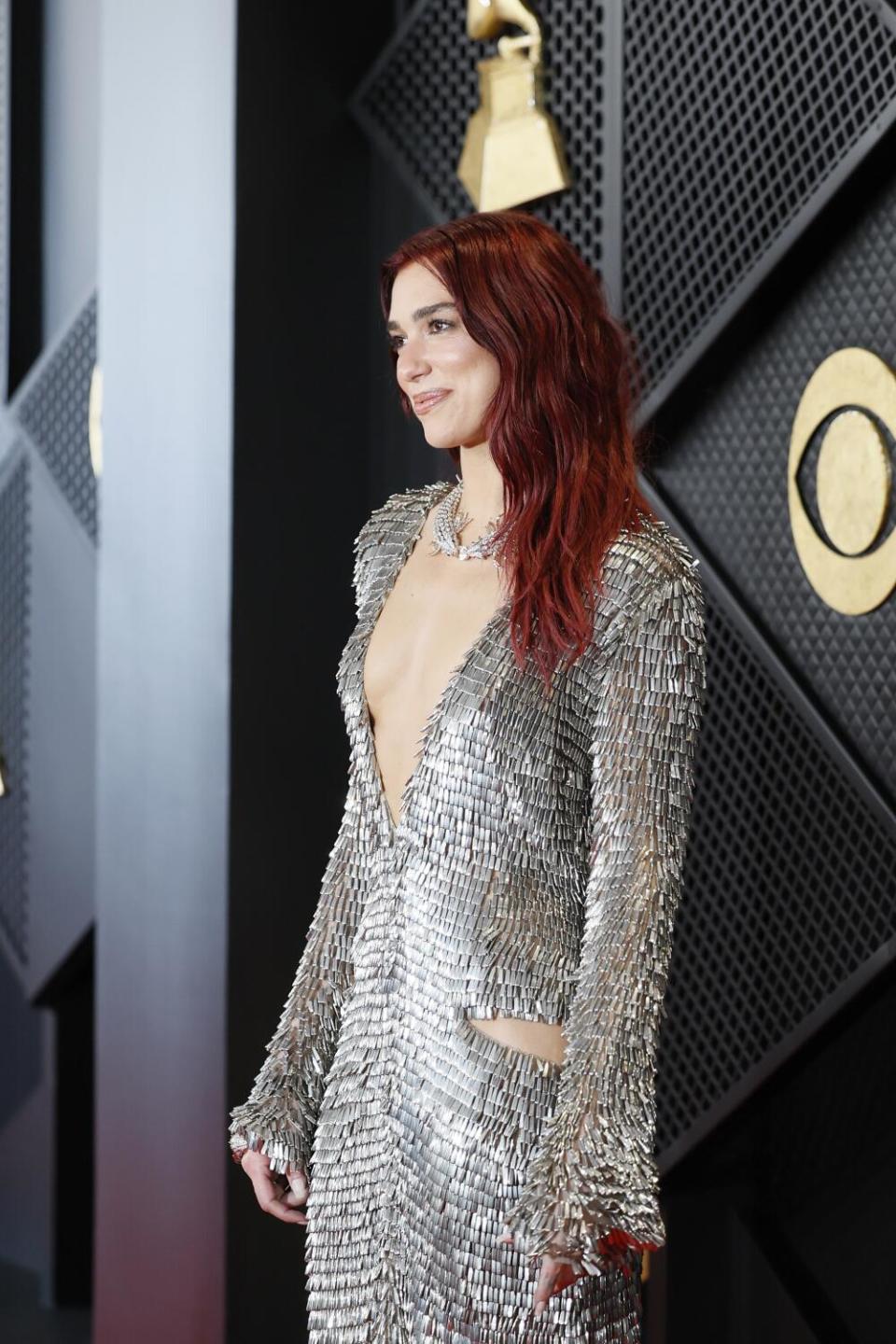 Dua Lipa in a long plunging silver dress