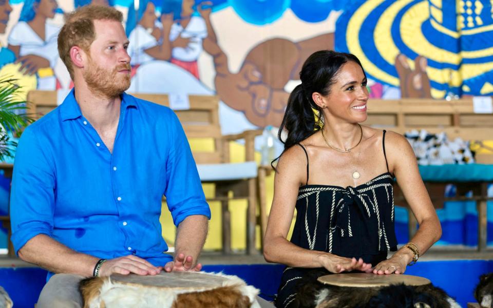 The Duke and Duchess of Sussex take a lesson at La Boquilla drum school in Cartagena