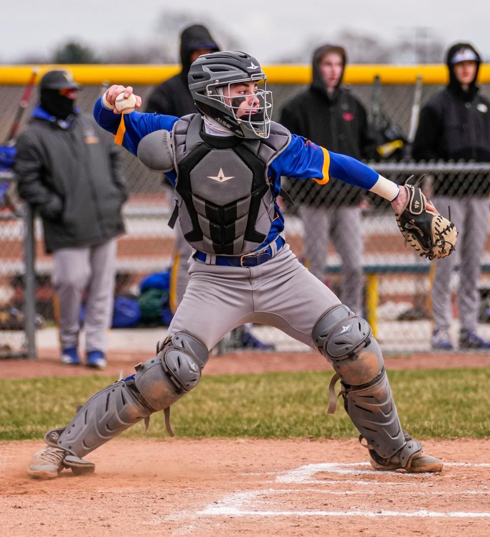 New Berlin West catcher Dominic Kibler (21) takes aim on second base during the game at Pewaukee on Wednesday, April 27, 2022.