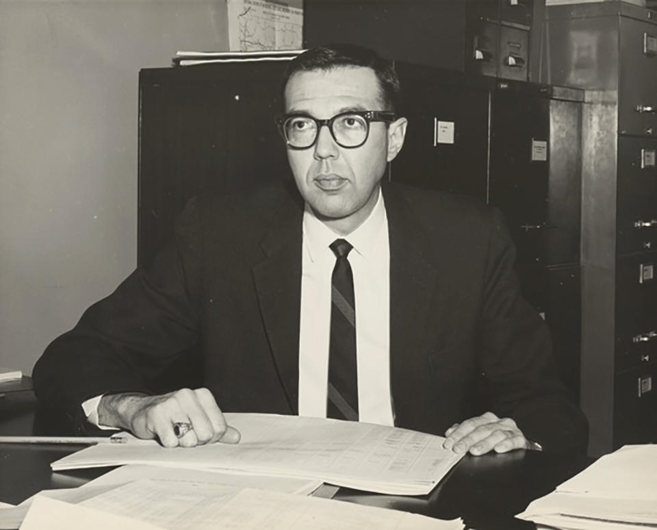 In this photo provided by the LGBT Center of Central PA History Project Collection at the Dickinson College Archives and Special Collections, Richard Schlegel is seen in his office at the Pennsylvania Department of Highways. Pennsylvania's historic preservation agency has removed a roadside marker that was installed in 2021 to honor Schlegel, a gay rights pioneer, after a state senator raised concerns about his 30-year-old remarks sympathetic to pedophilia. (Dickinson College Archives and Special Collections via AP)