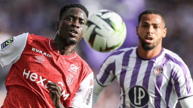 Joseph Okumu (left) in action for Reims against Toulouse