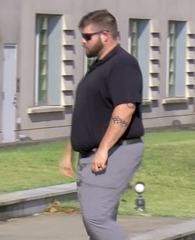 In this image taken from video, Daniel Opdyke, a former sheriff's deputy in Rankin County, Miss., walks into the federal courthouse in Jackson, Miss., on Thursday, Aug. 3, 2023. Opdyke and five other former law enforcement officers pleaded guilty Thursday to a racist assault on two Black men in a home raid that ended with an officer shooting one man in the mouth. (Jerome DeLoach/WLBT via AP)