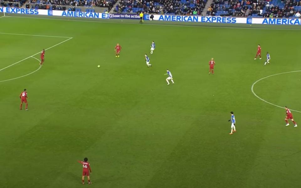 Joel Matip receives a pass in plenty of space in his own half against Brighton