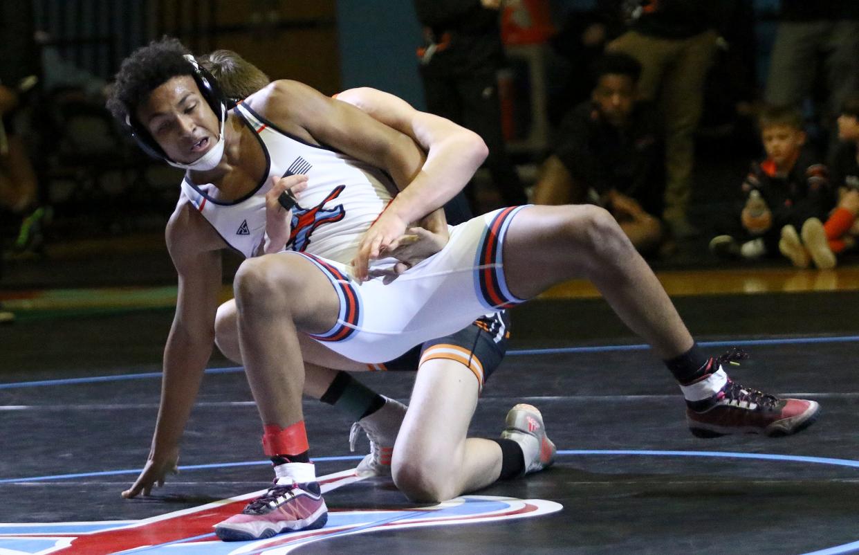 Alliance's Quinn Callock, front, and Marlington's Spencer McCarty during their 157-pound match Feb. 9, 2023, at Alliance.