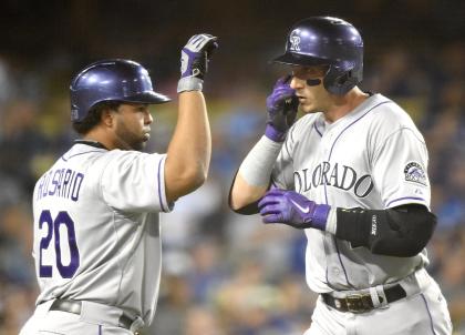 The Rockies' Troy Tulowitzki, right, celebrates his home run with Wilin Rosario on Friday night. (Getty)