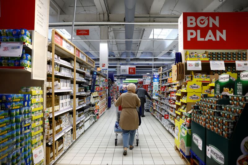 Customers shop in a supermarket near Paris