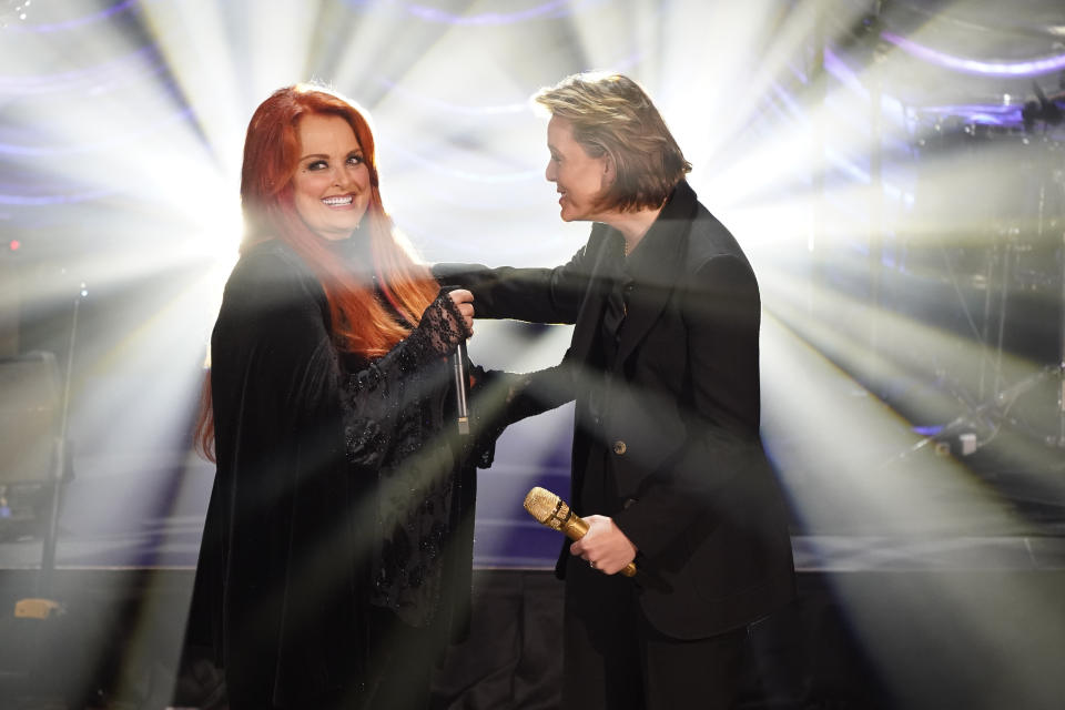 Wynonna Judd, left, and Brandi Carlile sing "The Rose," during a tribute to country music star Naomi Judd, Sunday, May 15, 2022, in Nashville, Tenn. Naomi Judd died April 30. She was 76. (AP Photo/Mark Humphrey)