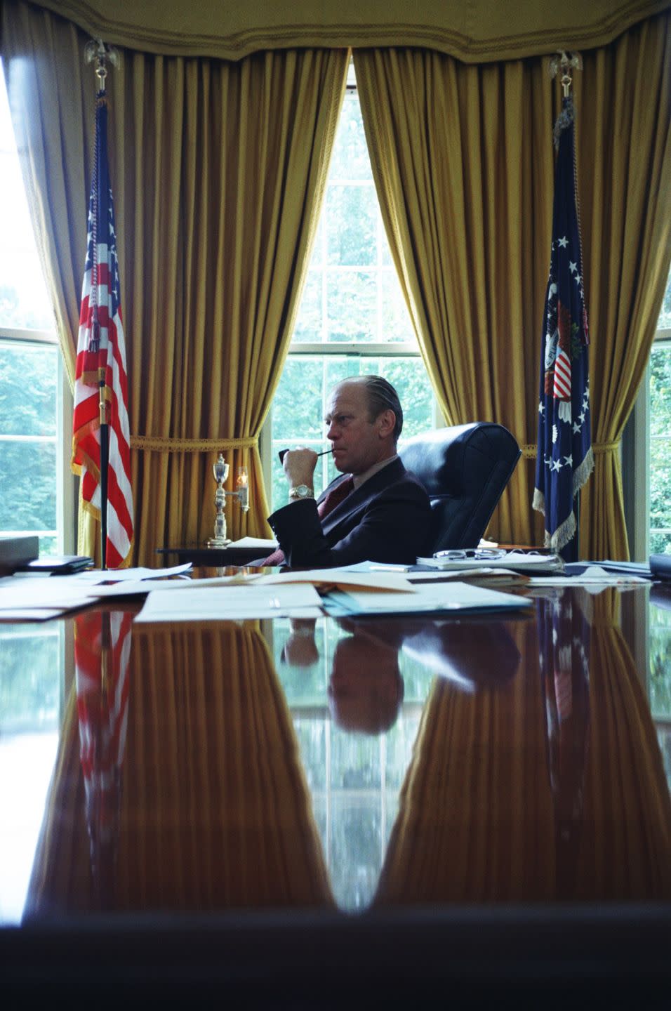 <p>President Gerald Ford, who stepped into the presidency after Richard Nixon's resignation on August 9, 1974, sits in the Oval Office.</p>