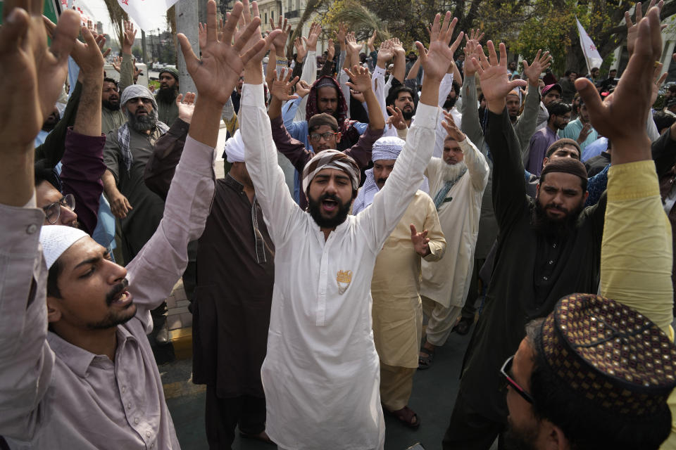 Supporters of a religious group 'Tehreek-e-Labiak Pakistan' chant slogans during a rally against a woman who recently arrested in the blasphemy charges, in Lahore, Pakistan, Monday, April 17, 2023. Pakistani police arrested a Muslim woman on charges of blasphemy after she allegedly claimed she was an Islamic prophet. She was taken into custody from her home in the eastern Punjab province after a mob had gathered outside demanding that she be lynched after news spread of her alleged claims of prophethood. (AP Photo/K.M. Chaudary)