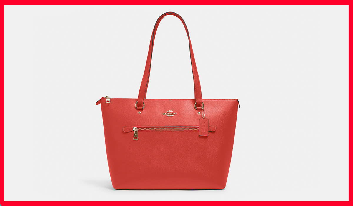 Red Coach tote bag with side zipper pocket