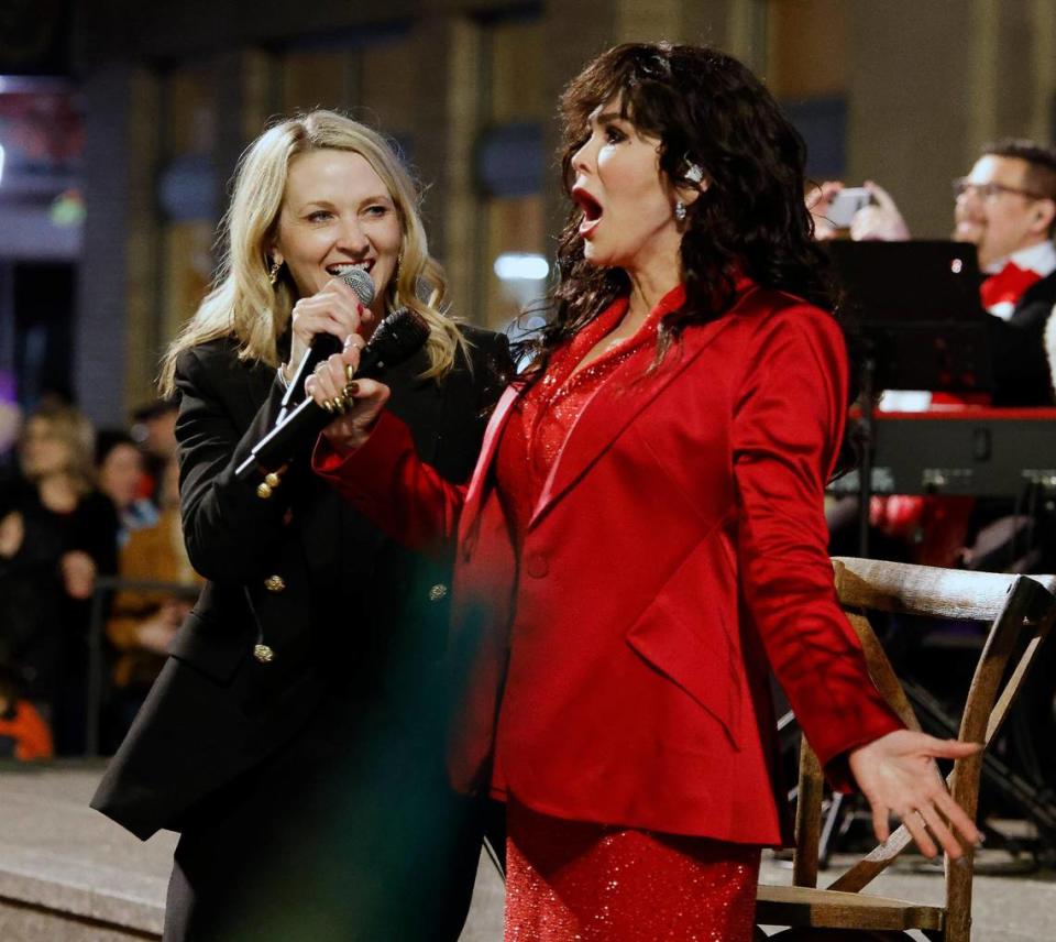 Fort Worth Mayor Mattie Parker and Marie Osmond react after counting down to the lighting of Fort Worth’s Christmas tree in Sundance Square plaza. Bob Booth/Bob Booth