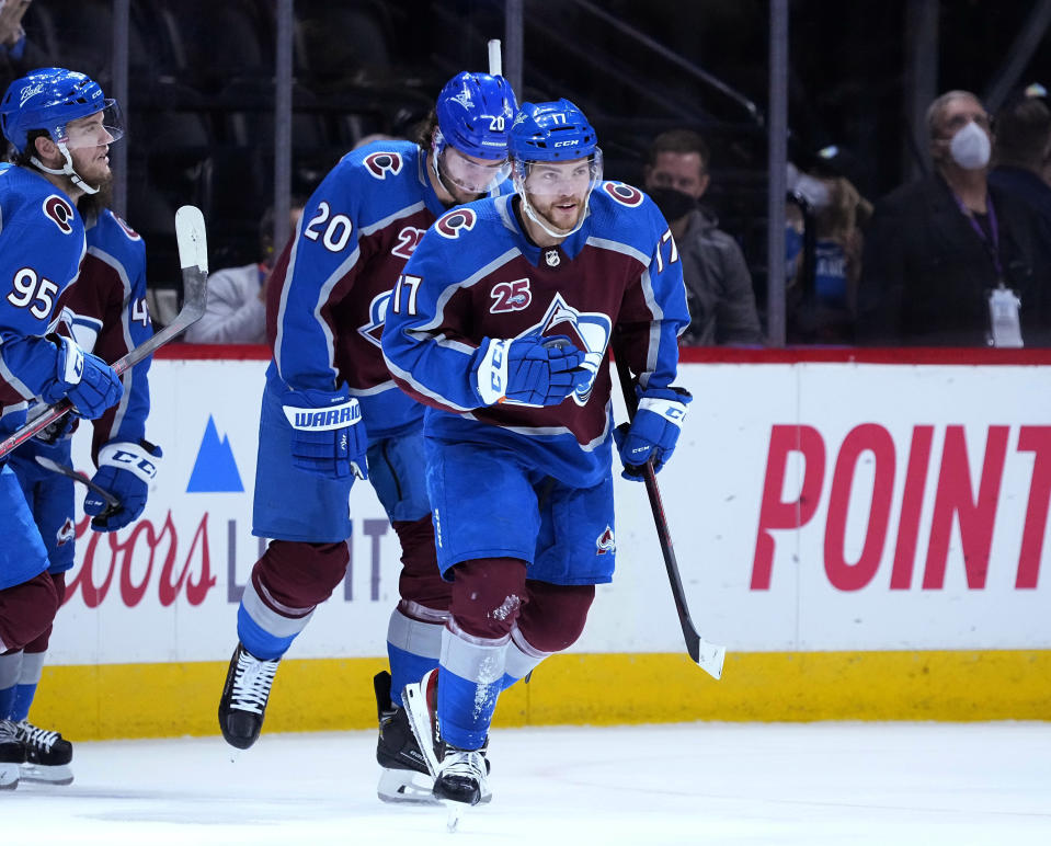 Colorado Avalanche center Tyson Jost (17) celebrates a goal against the Vegas Golden Knights during the first period in Game 2 of an NHL hockey Stanley Cup second-round playoff series Wednesday, June 2, 2021, in Denver. (AP Photo/Jack Dempsey)
