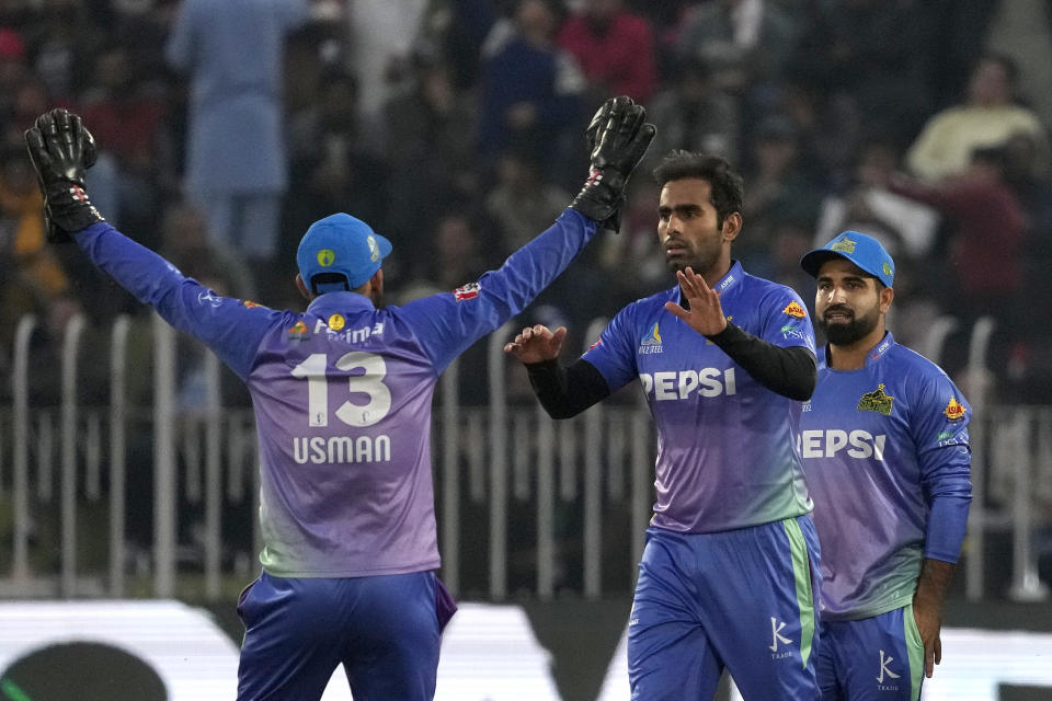 Multan Sultans' Mohammad Ali, center, celebrates with teammates after taking the wicket of Islamabad United' Haider Ali during the Pakistan Super League T20 cricket match between Islamabad United and Multan Sultans, in Rawalpindi, Pakistan, Sunday, March 10, 2024. (AP Photo/Anjum Naveed)