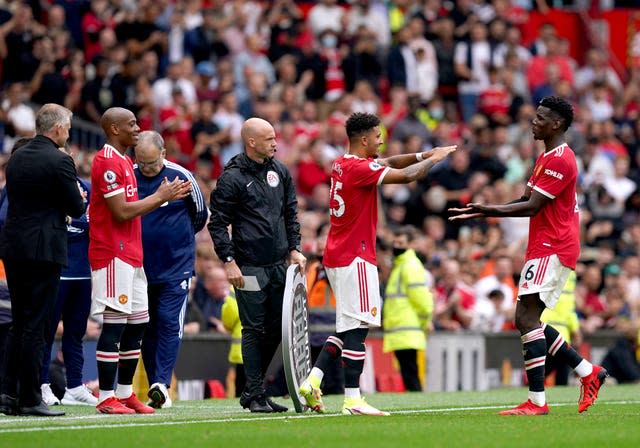 Jadon Sancho (centre) moved from Borussia Dortmund to Manchester United for £73m in July (Martin Rickett/PA).