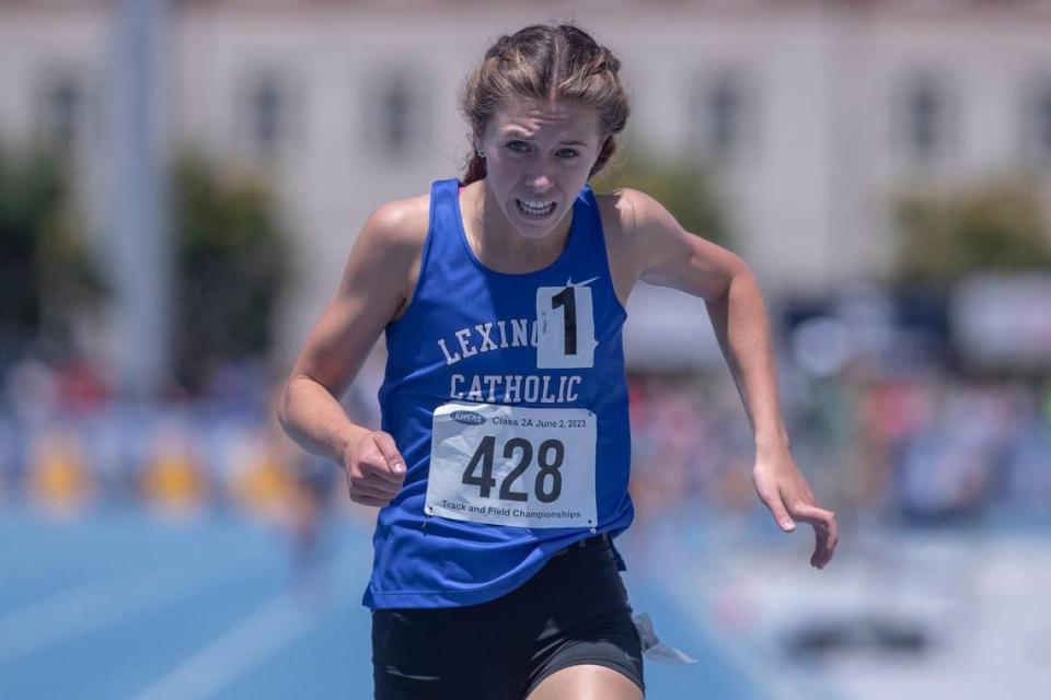 Lexington Catholic’s Caroline Beiting sets a state record with her win in the 800 meters at the Class 2A state championships at the University of Kentucky Track and Field Facility on Friday.