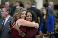 Pilar Schiavo, left, of District 40, embraces Malia Cohen, California Controller during the opening session of the California Legislature in Sacramento, Calif., Monday, Dec. 5, 2022. The legislature returned to work on Monday to swear in new members and elect leaders for the upcoming session. (AP Photo/José Luis Villegas, Pool)