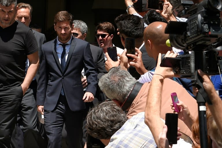 Barcelona's football star Lionel Messi (2ndL) leaves the courthouse on June 2, 2016 in Barcelona