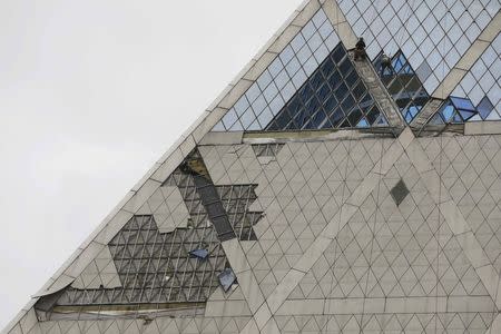 A general view shows the Palace of Peace and Harmony, the 62 metres (209.97 feet) high pyramid designed by British architect Lord Norman Foster, damaged by gale-force winds in Astana, Kazakhstan May 22, 2018. REUTERS/Mukhtar Kholdorbekov