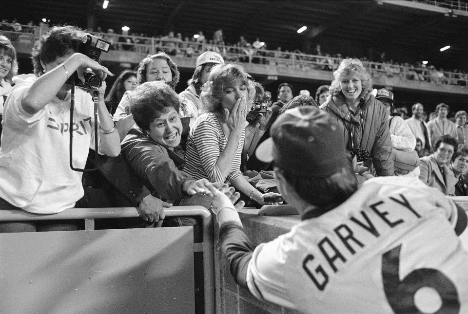 FILE - San Diego Padres Steve Garvey, formerly of the Los Angeles Dodgers, greet some of his loyal fans at Dodger Stadium on April 16, 1983 in Los Angeles. The candidacy for the U.S. Senate of former California baseball star Garvey has brought a splash of celebrity to the race that has alarmed his Democratic rivals and tugged at the state's political gravity. (AP Photo/Lennox McLendon, File)