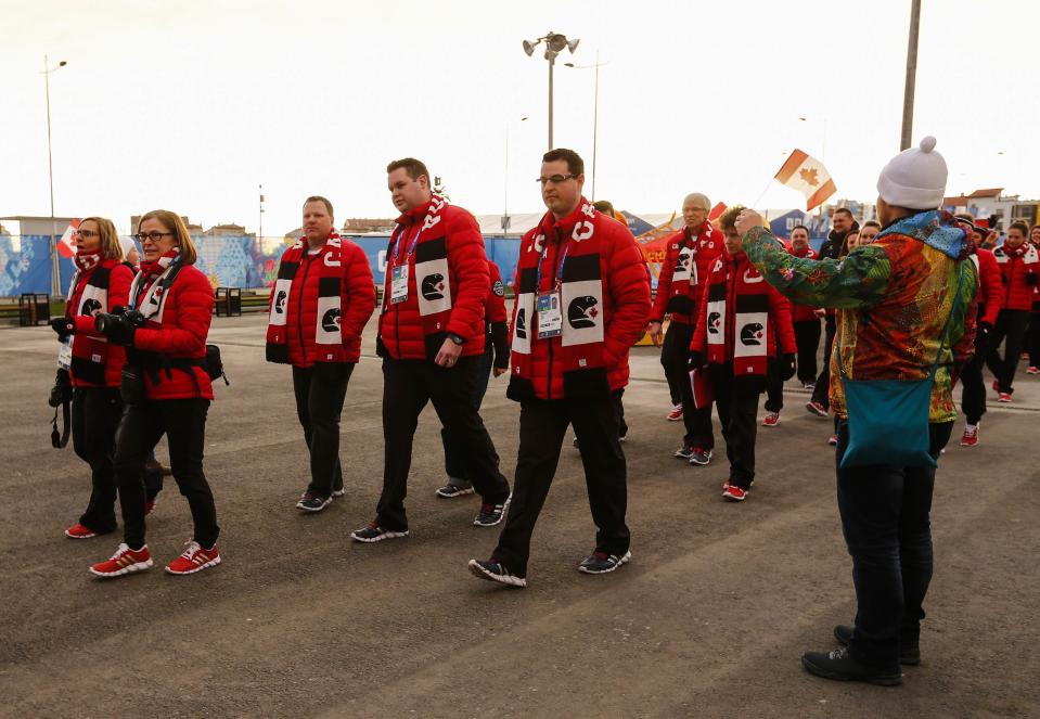 Members of Canada's Olympic Team arrive at the welcoming ceremony for the team in the Athletes Village, at the Olympic Park ahead of the 2014 Winter Olympic Games in Sochi February 5, 2014. REUTERS/Shamil Zhumatov (RUSSIA - Tags: SPORT OLYMPICS)