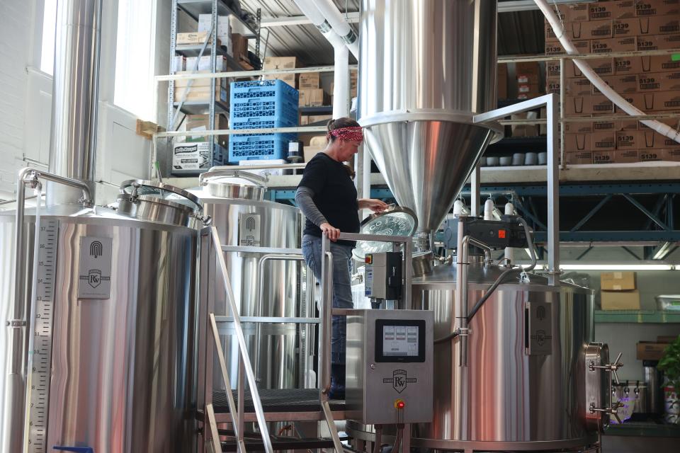 Bell Tower co-founder and head brewer Jennifer Hermann works in the brewery.