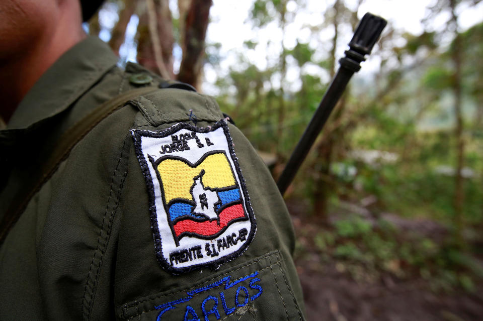 <p>Carlos, a member of the 51st Front of the Revolutionary Armed Forces of Colombia (FARC), is seen at a camp in Cordillera Oriental, Colombia, August 16, 2016. (John Vizcaino/Reuters) </p>