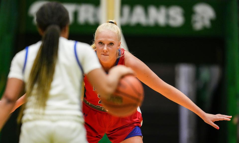 Indian Creek's Faith Wiseman (21) watches the ball against Lake Central's guard Kennedie Burks (1) on Thursday, Oct. 5, 2023, during the Hall of Fame Classic girls basketball tournament at New Castle Fieldhouse in New Castle. Lake Central defeated Indian Creek, 51-45.