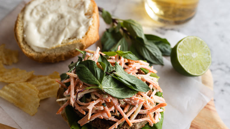 Open turkey burger with carrot slaw and Thai basil