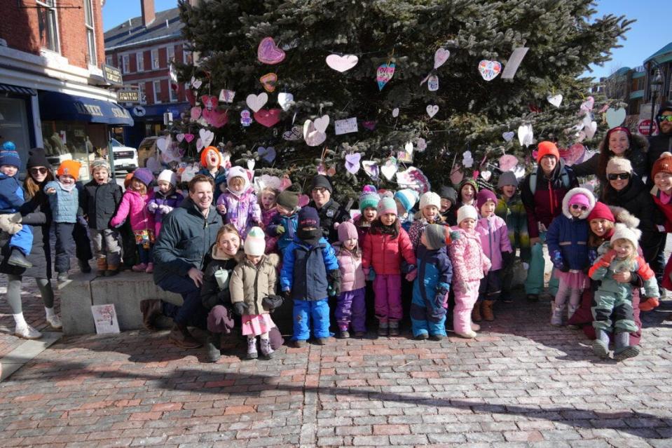 Portsmouth N.H. Mayor Deaglan McEachern thanks Treehouse School children for their help decorating the “Tree of Love” for Valentine’s Day in 2024.