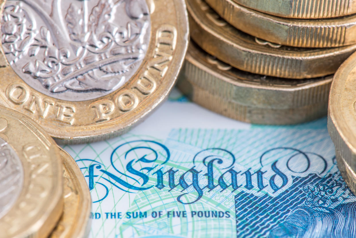 £1 coins and a £5 bank note on a story about universal credit