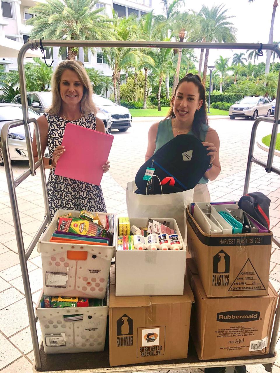 Nancy Stellway, executive director of Take Stock in Children, left, and Lidia Vargas, director of development, collect school supplies during the 2021 drive.