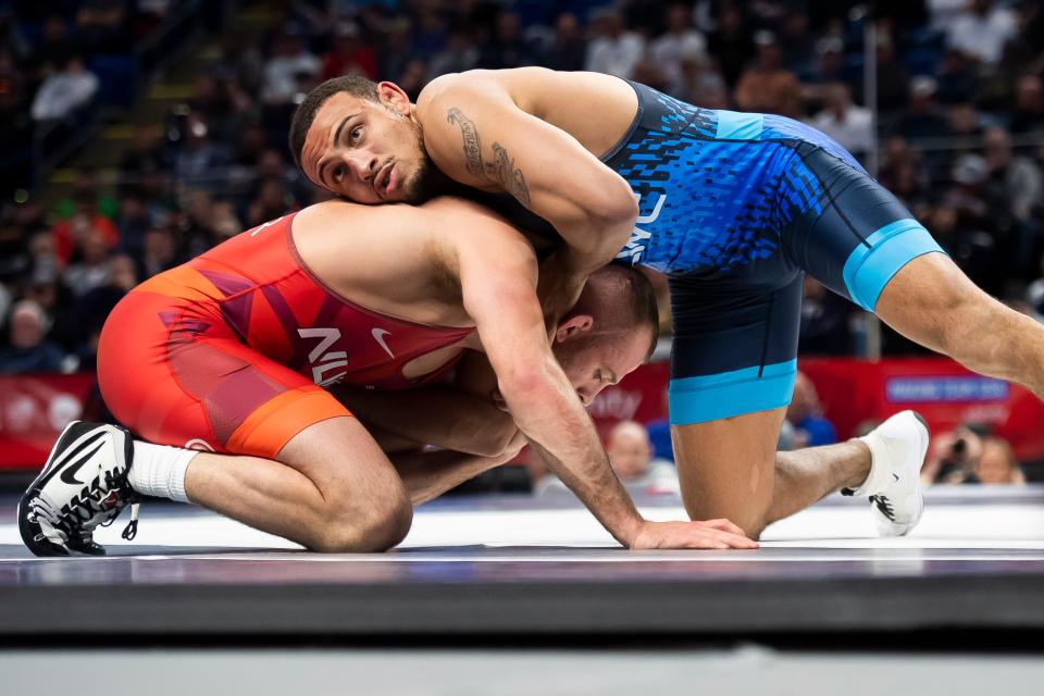 Aaron Brooks (top) wrestles David Taylor in the 86 kilogram best-of-three championship series during the U.S. Olympic Team Trials at the Bryce Jordan Center April 20, 2024, in State College. Brooks won the first bout, 4-1.